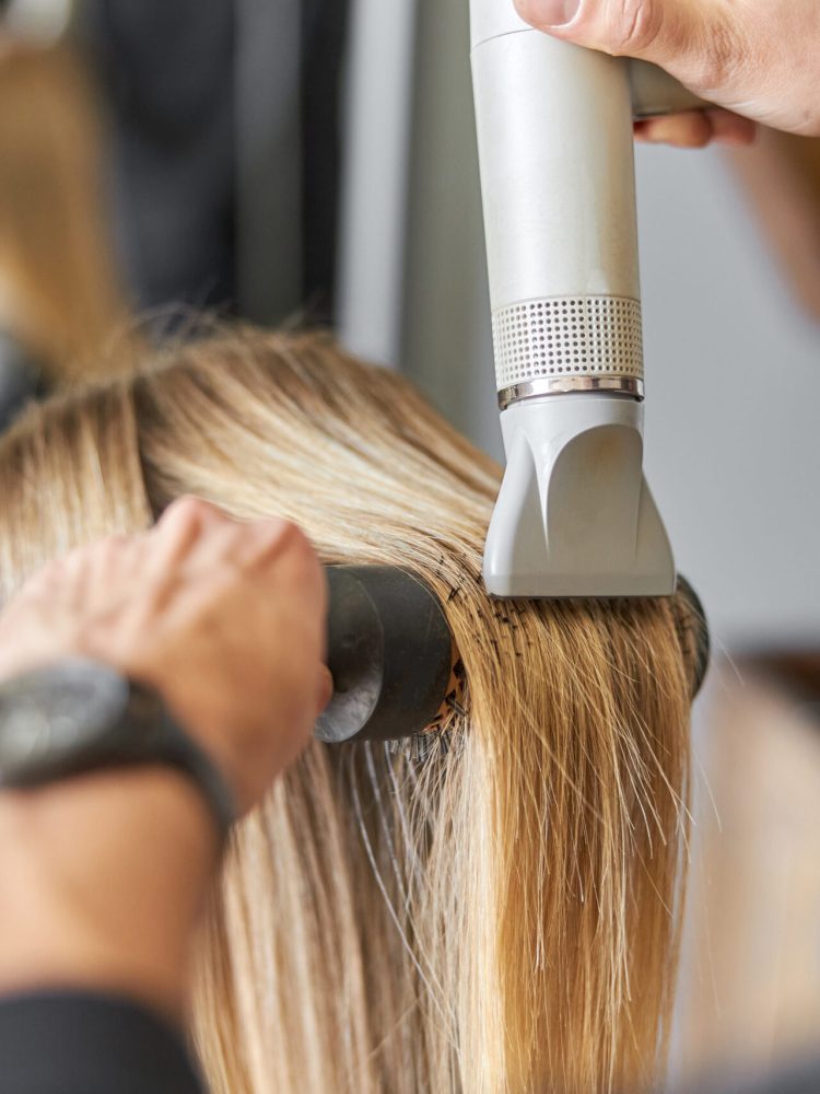 Hair drying process in modern hairdresser's salon