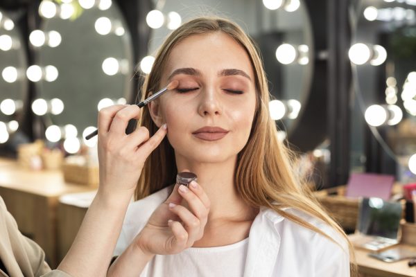 make-up-artist-applying-eyeshadow-woman